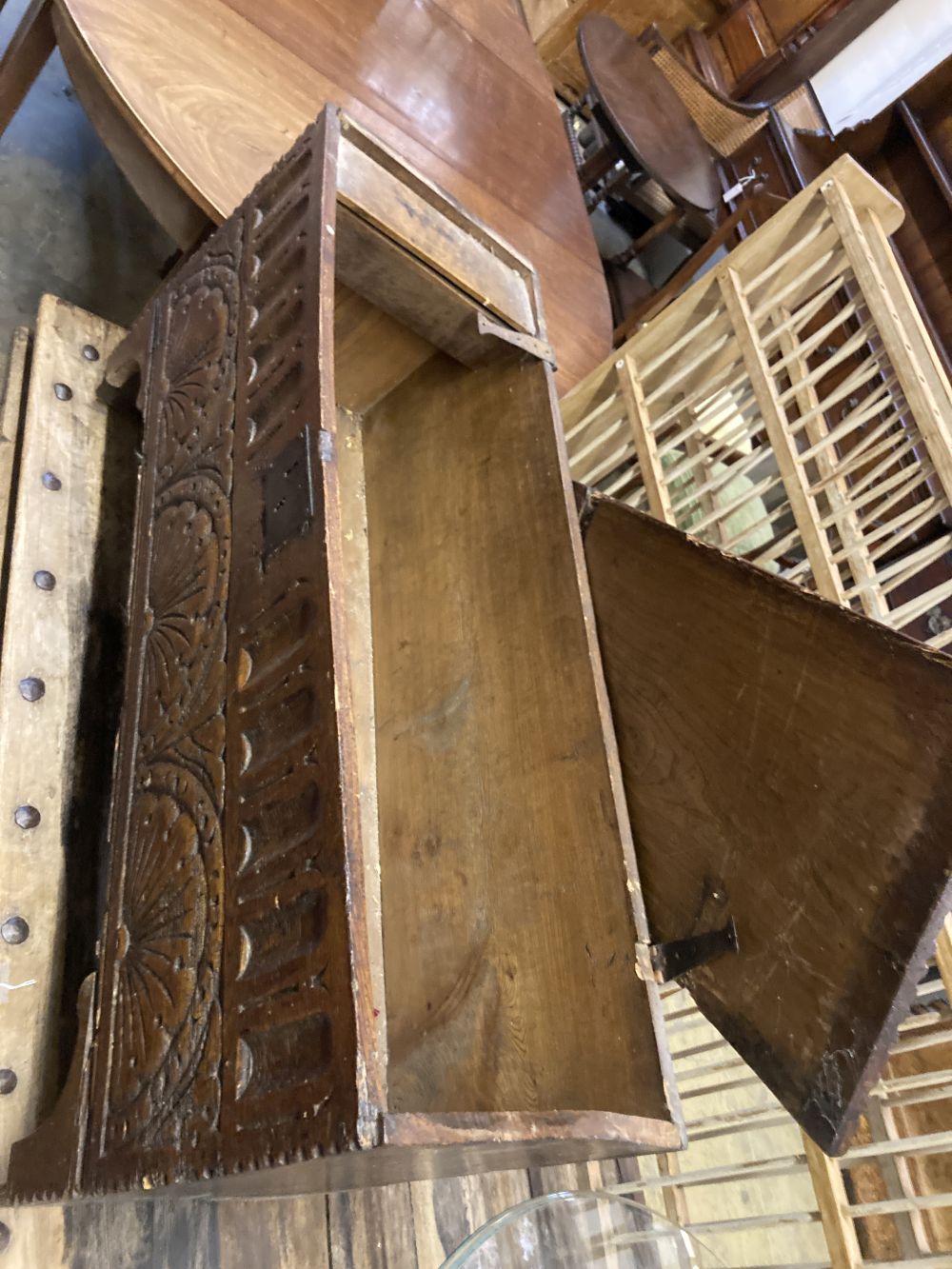 An elm and oak six plank coffer with lunette carved front, width 112cm depth 36cm height 58cm